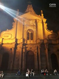 People in front of historical building