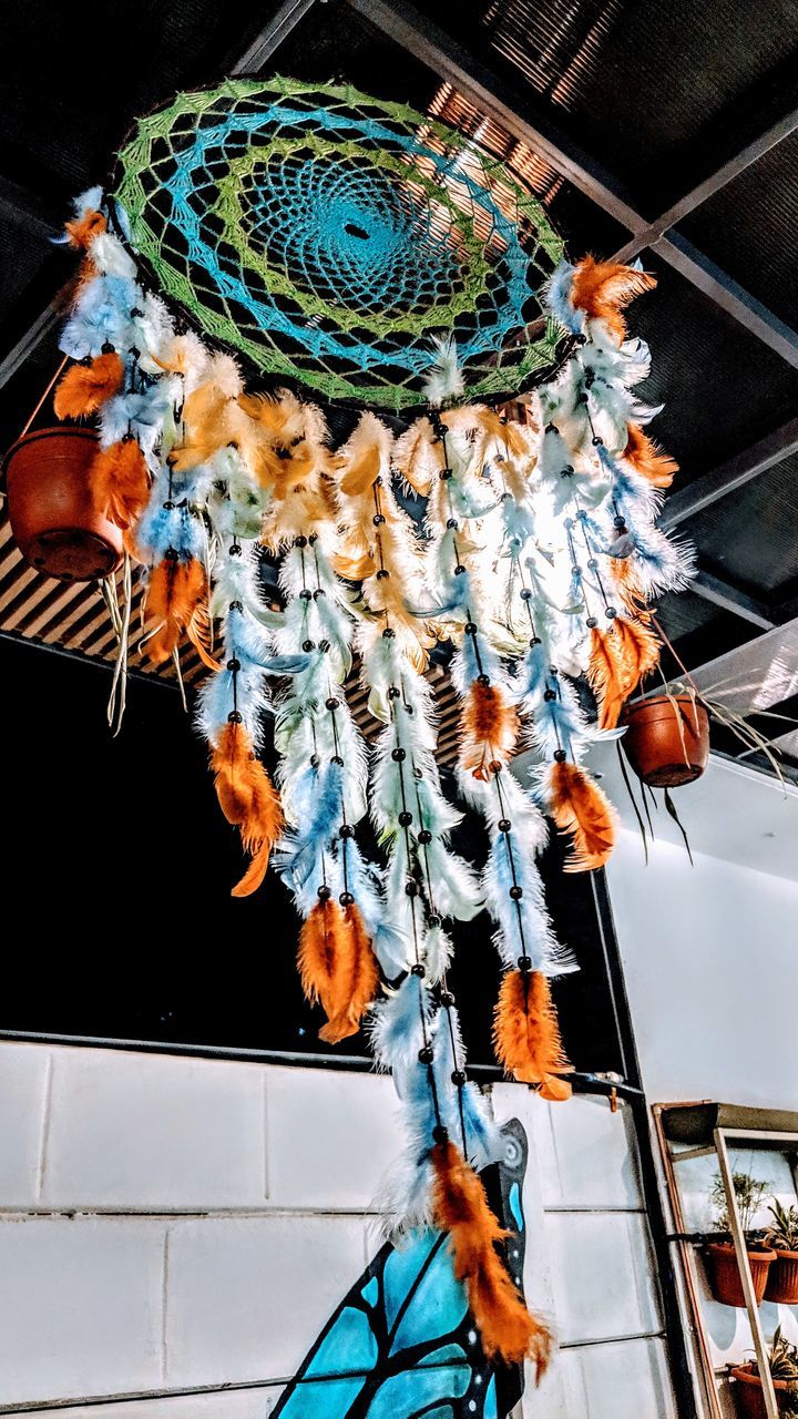 LOW ANGLE VIEW OF DECORATED HANGING FROM CEILING