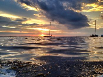 Scenic view of sea against cloudy sky