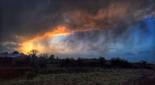 Panoramic shot of bonfire on field against sky