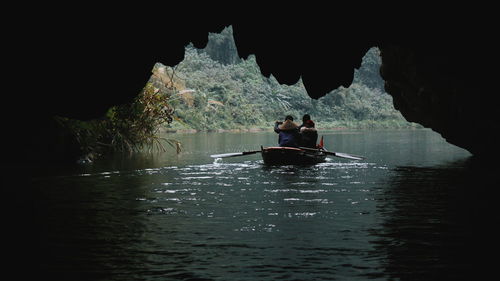 People on boat in river