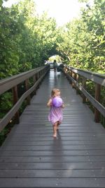 Girl walking on railing