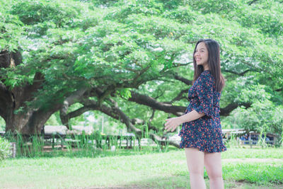 Full length of woman standing in park