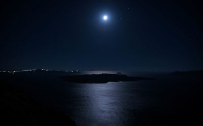 Scenic view of sea against sky at night