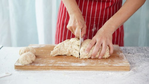 Midsection of man preparing food