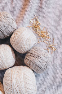 Directly above shot of string balls on tablecloth