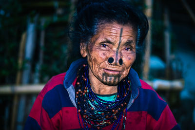 Portrait of smiling senior woman outdoors