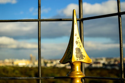 Close-up of metal against sky