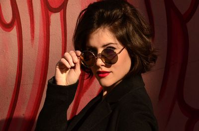 Portrait of young woman wearing sunglasses