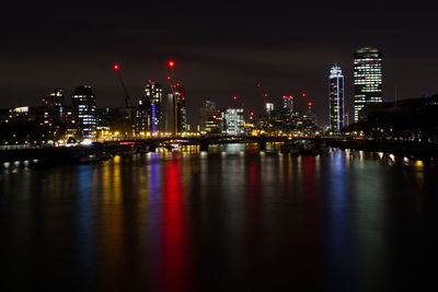 Illuminated city at waterfront