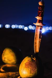 Close-up of illuminated lighting equipment at night