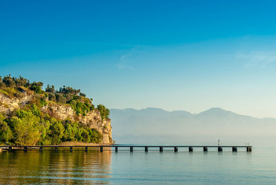 Scenic view of lake against blue sky