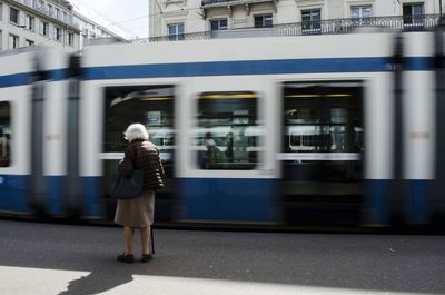 Blurred motion of train at railroad station