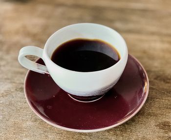 High angle view of coffee cup on table