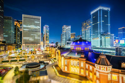 Aerial view of buildings in city at night