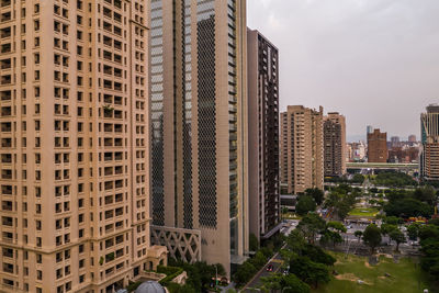 Modern buildings in city against sky