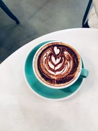 Directly above shot of coffee cup on table