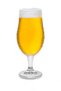 Close-up of beer glass against white background