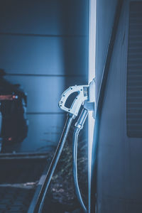 Close-up of electric car charger at night 
