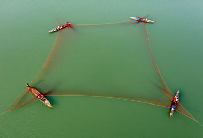 Aerial view of fishing boats in sea