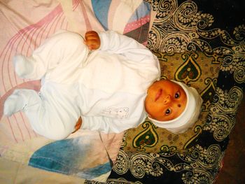 High angle view portrait of woman on bed at home