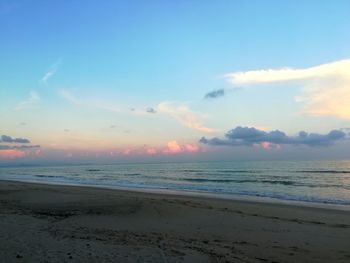 Scenic view of beach against sky during sunset