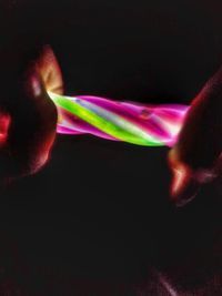 Close-up of lamp over black background