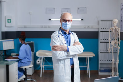 Portrait of young man standing in laboratory