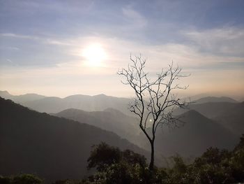 Scenic view of silhouette mountains against sky at sunset