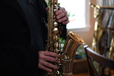 Close-up of man playing guitar