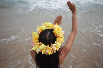 Close-up of woman holding flower