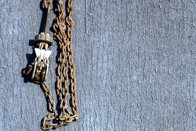 High angle view of ropes tied on rope against wall