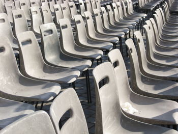 Full frame shot of empty seats arranged in stadium