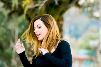 Young woman standing outdoors