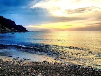 Scenic view of sea against sky during sunset