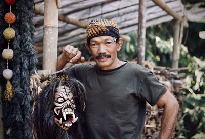 Portrait of man standing outdoors