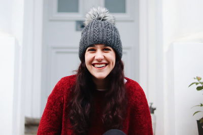 Portrait of smiling young woman wearing warm clothing