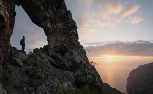 Scenic view of rock formation against sky during sunset