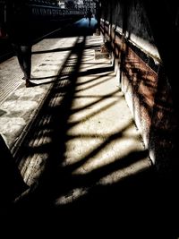 Low section of man on sidewalk in city