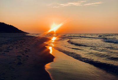 Scenic view of sea against sky during sunset