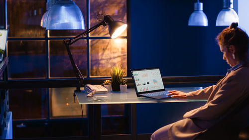 Man using laptop at table