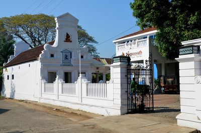 Buildings in city against blue sky