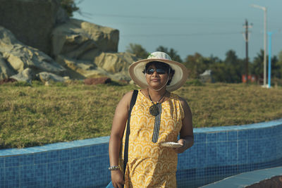 A casual looking indian tourist girl at shankarpur sea beach, in west bengal.