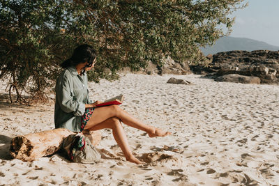 Woman sitting on beach