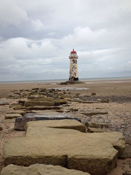 VIEW OF LIGHTHOUSE AGAINST CLOUDY SKY