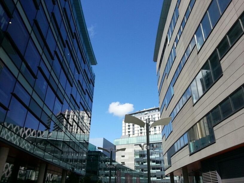 architecture, building exterior, built structure, low angle view, city, building, window, blue, sky, modern, residential building, office building, residential structure, clear sky, day, outdoors, glass - material, no people, city life, apartment