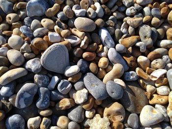 High angle view of stones on pebbles