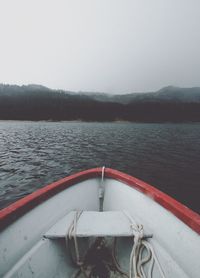 Boat in lake against sky