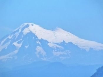 Scenic view of mountains against clear blue sky