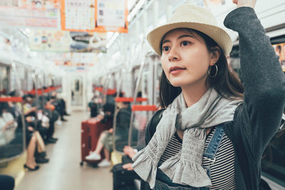 Portrait of young woman in hat